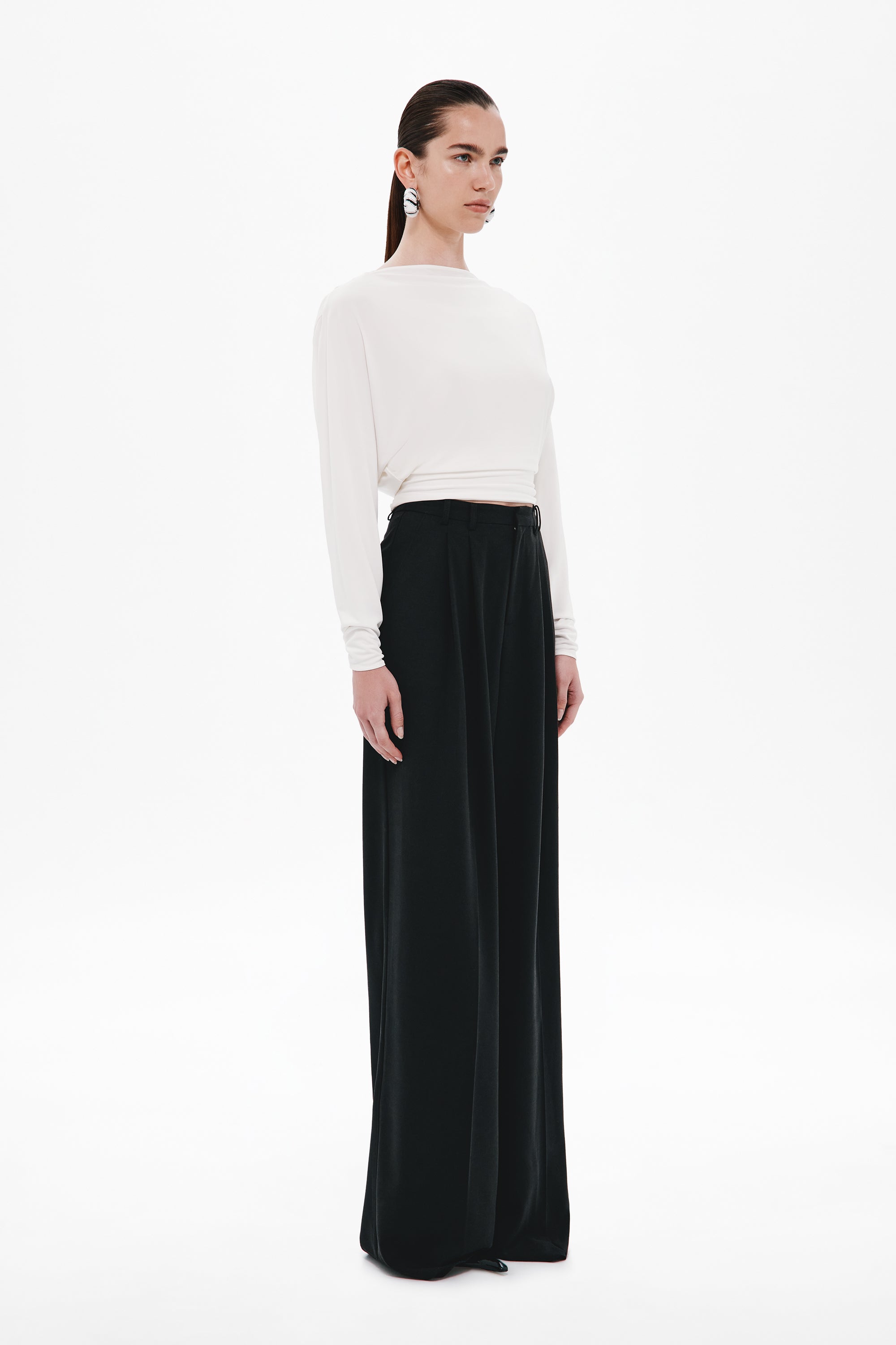 Ivory long-sleeve jersey top with open V-back and gathered drape