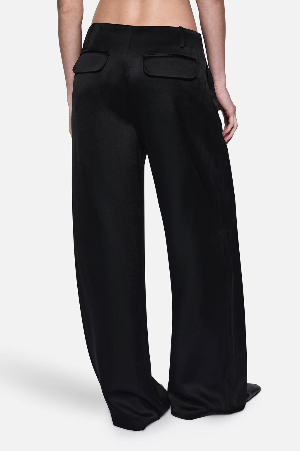 Black wide-leg acetate pants with high waist, front pockets, and center crease