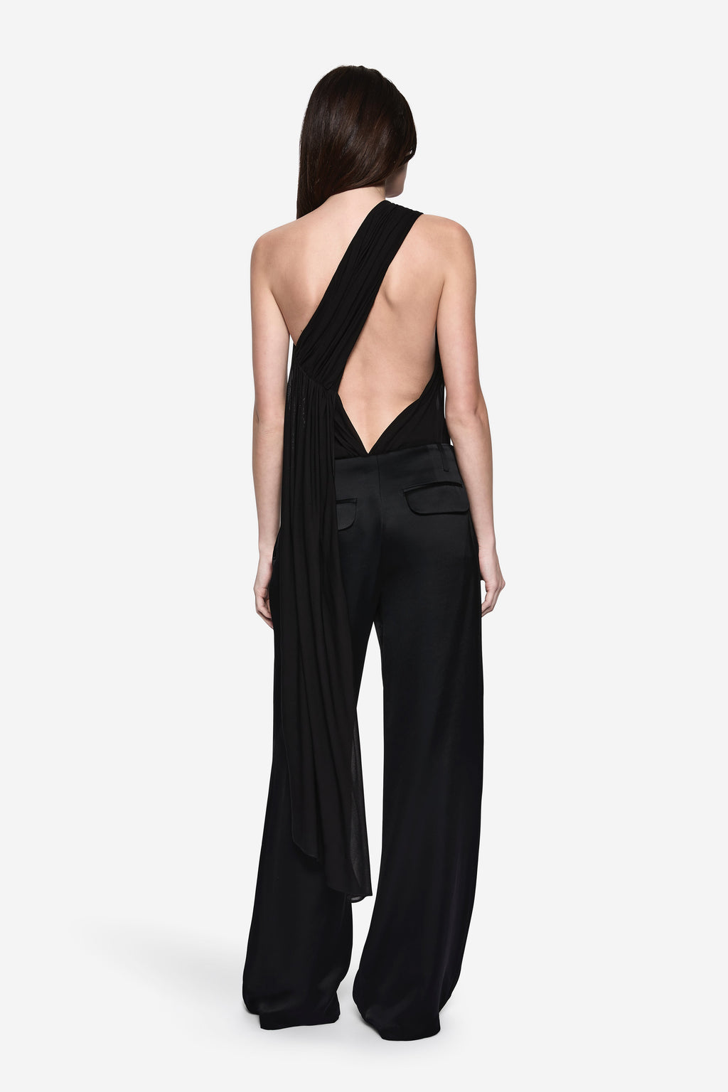 Back view of black wide-leg acetate pants with patch pockets and high waist