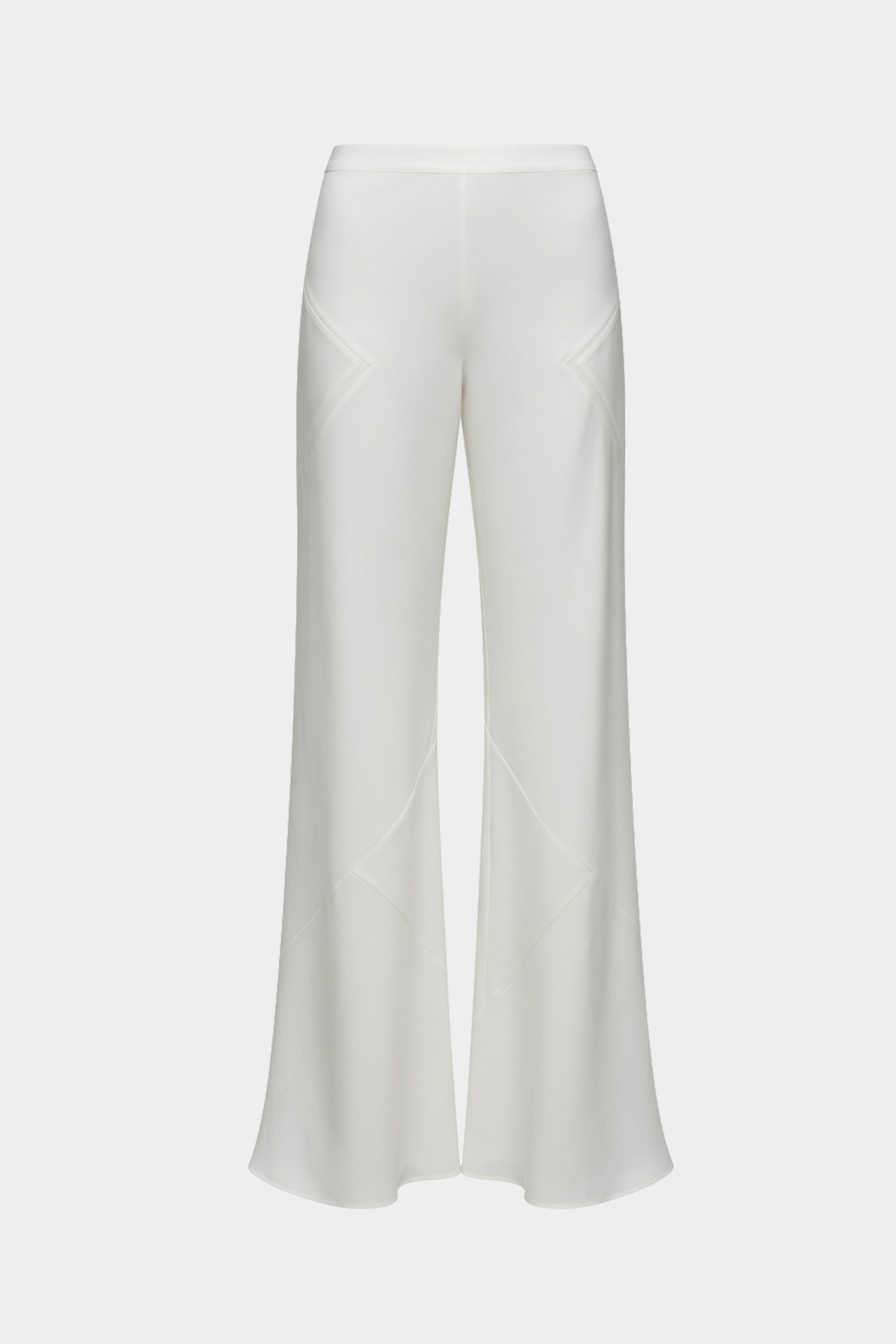 Ivory silk bias pants, flat front view with wide bell legs and sculpted panel seams