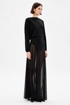 Black sheer maxi dress with long sleeves, draped top, and floor-length skirt