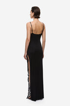 Black jersey slip dress with lace trim along side seams, spaghetti straps