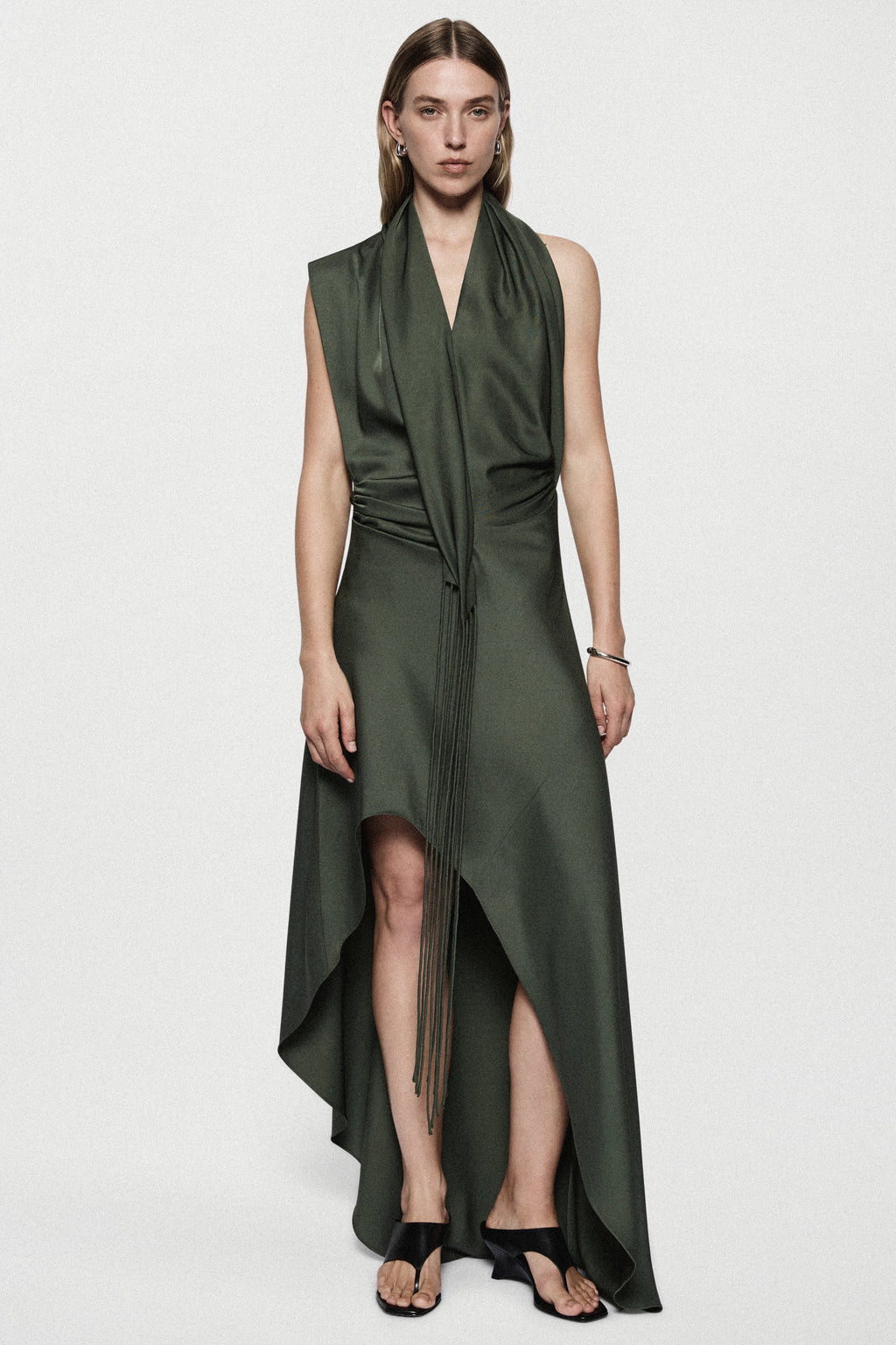 Hunter green satin halter mini dress with thigh slit and flowing asymmetrical skirt