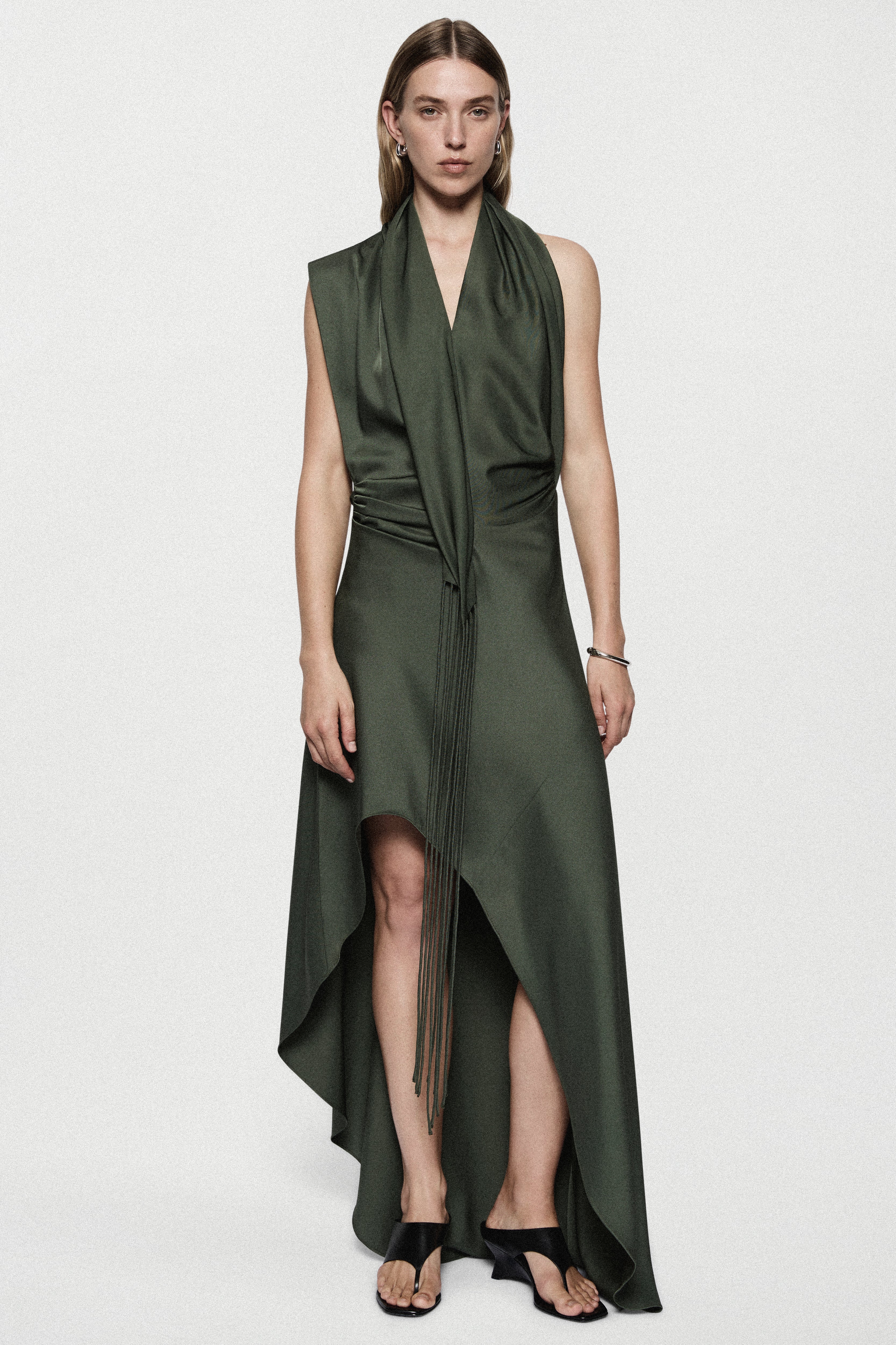 Hunter green satin halter mini dress with thigh slit and flowing asymmetrical skirt