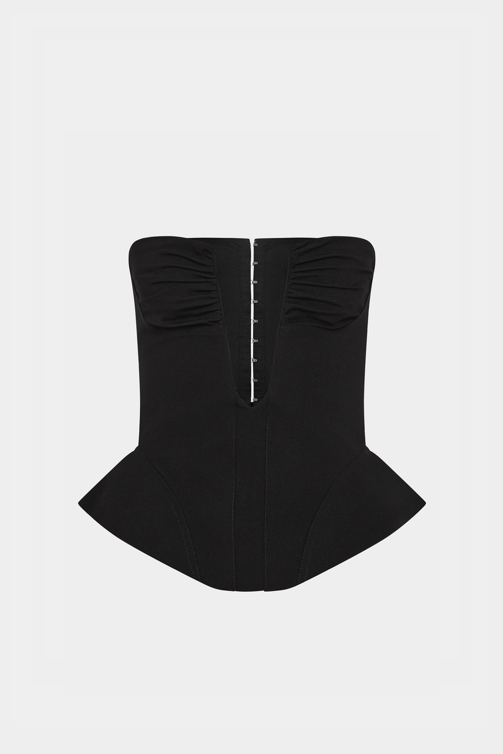 Black strapless corset top with boned front and curved peplum hem