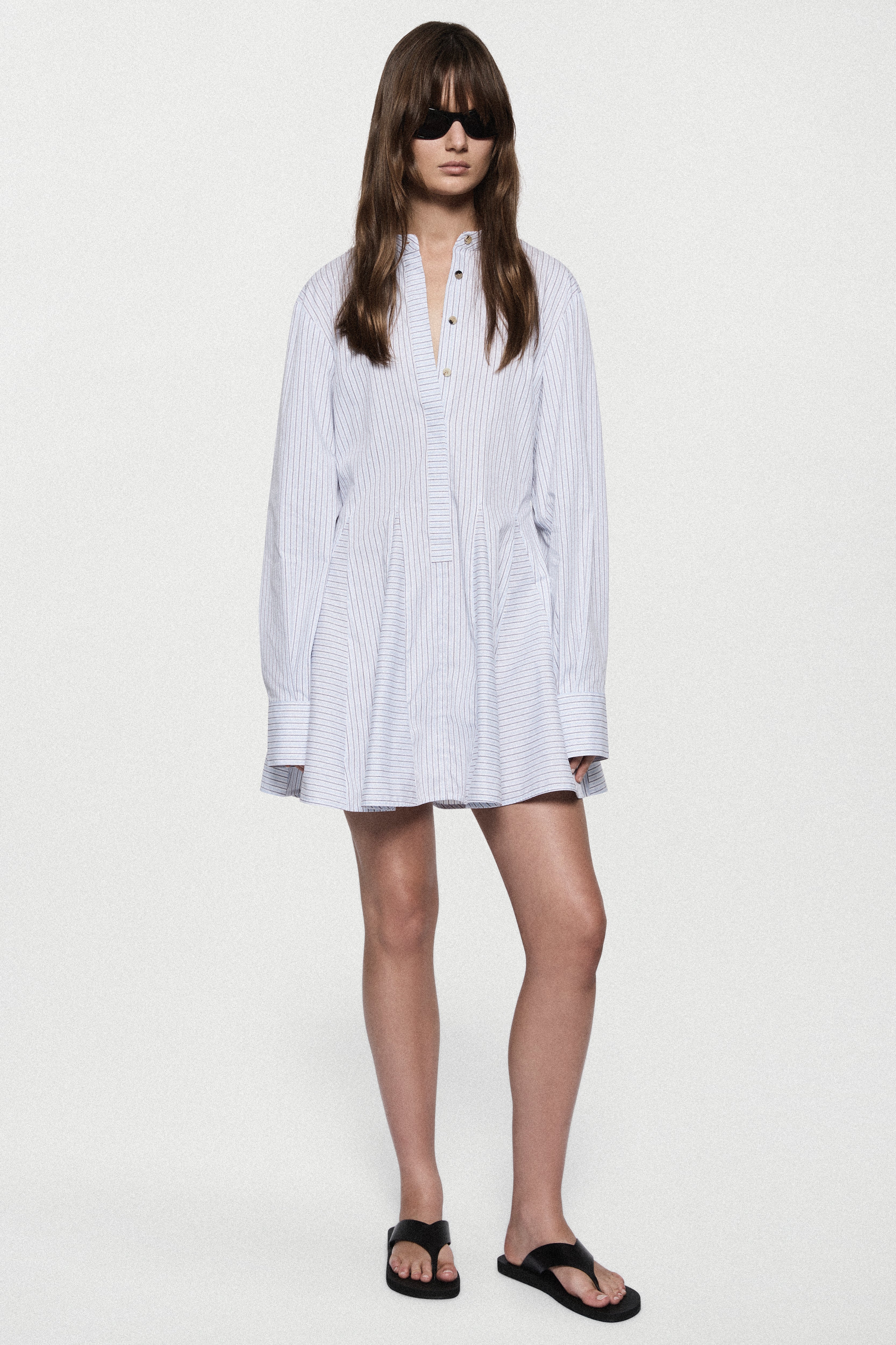 Blue striped cotton mini dress with button-front V-neck and long puff sleeves