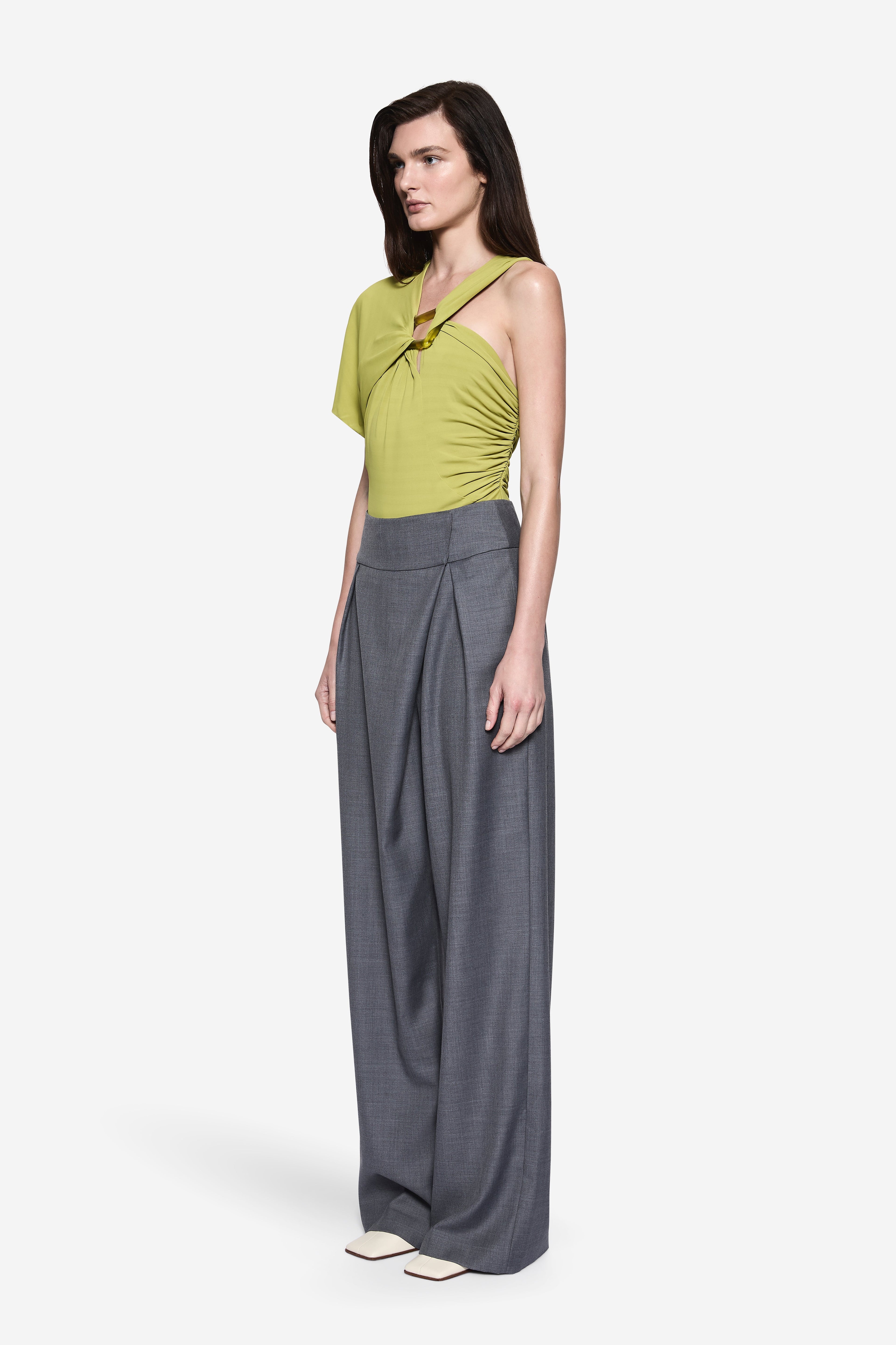 Matcha green jersey bodysuit with V-neck, short sleeves, and ruched waist