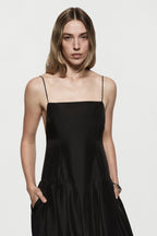 Black silk sundress front view with spaghetti straps and gathered skirt hem