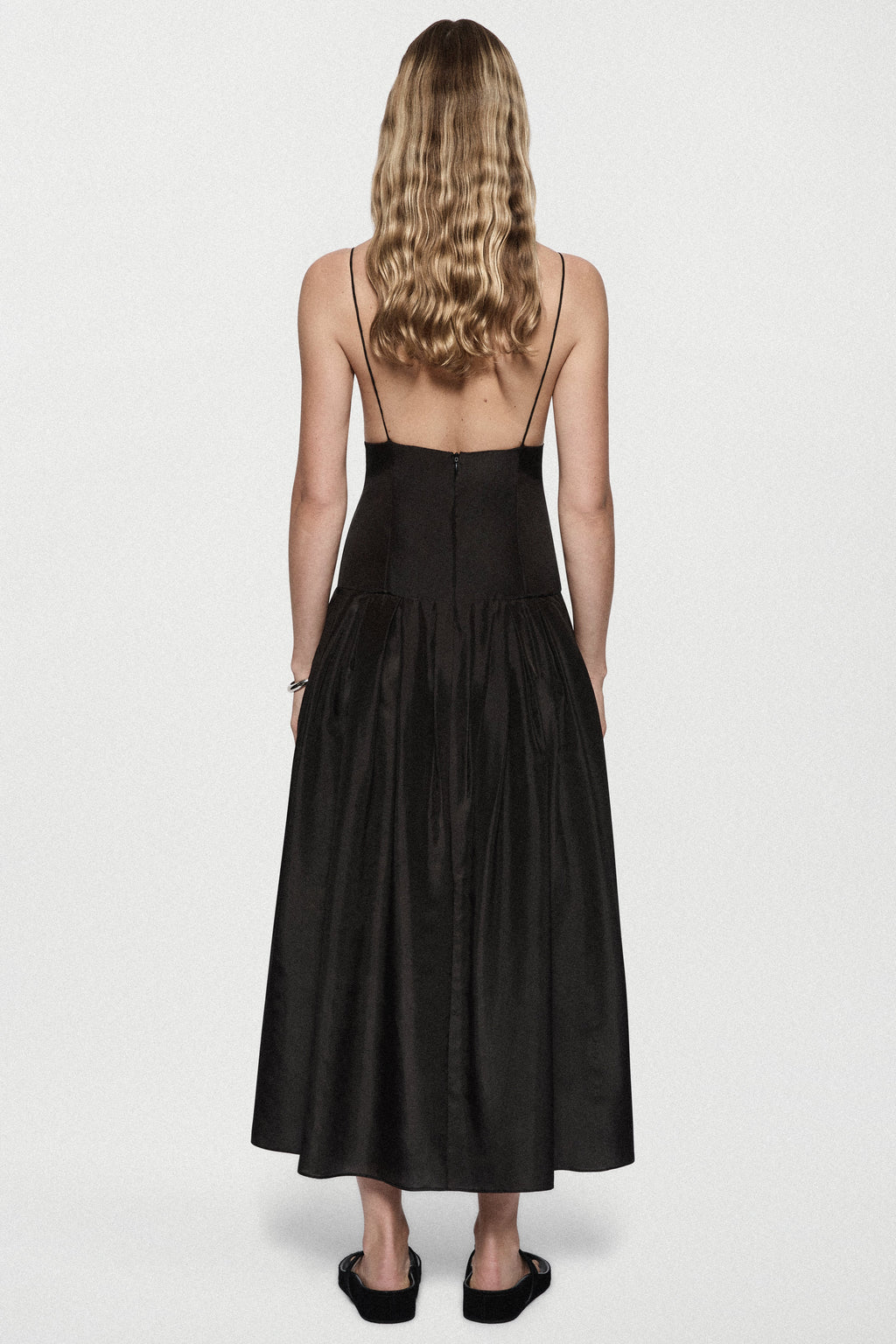 Black silk sundress back view with spaghetti straps and gathered midi skirt