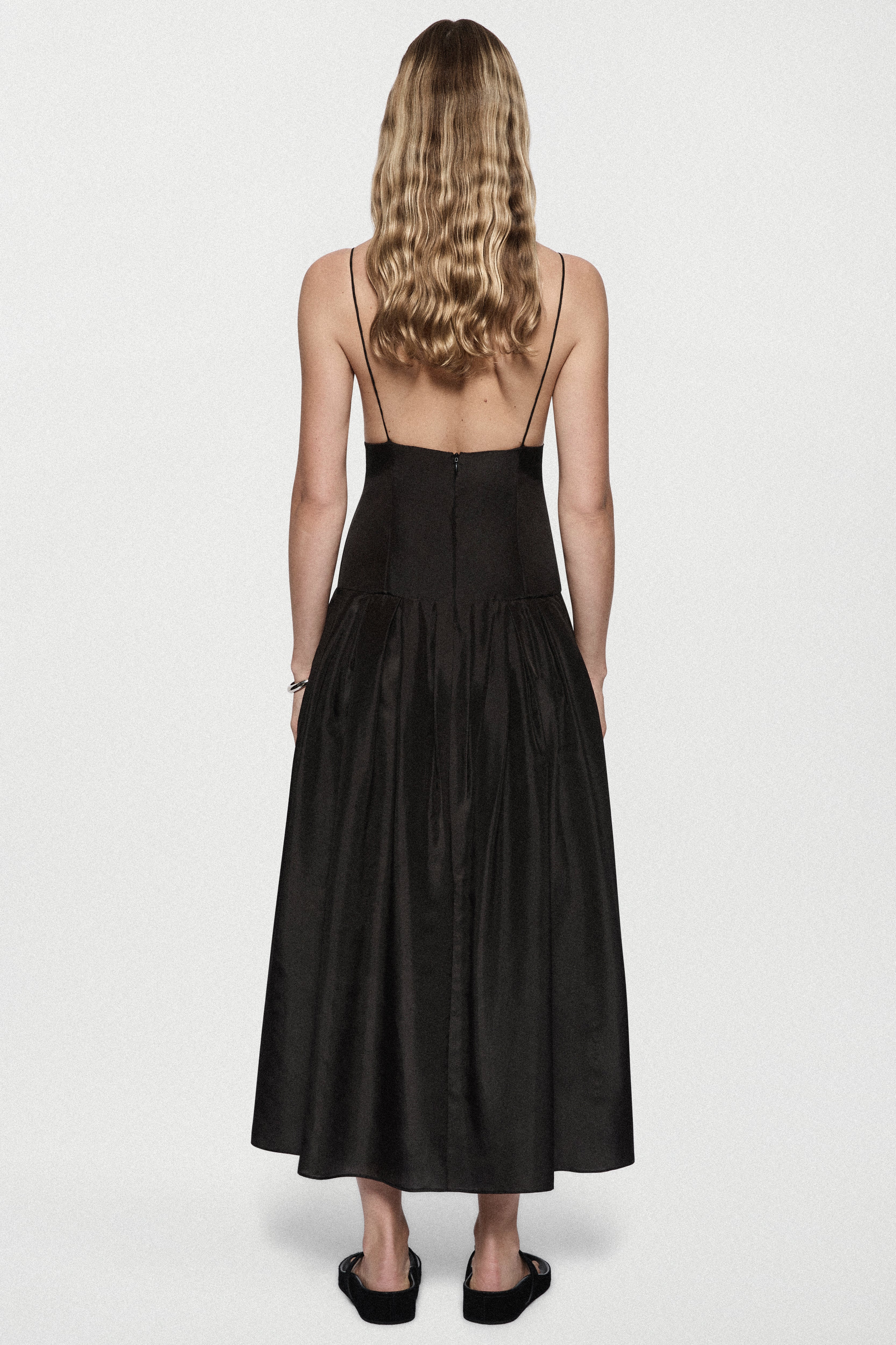 Black silk sundress back view with spaghetti straps and gathered midi skirt