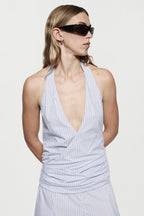 Blue-and-white striped cotton maxi dress close-up with V-neck halter and ruching