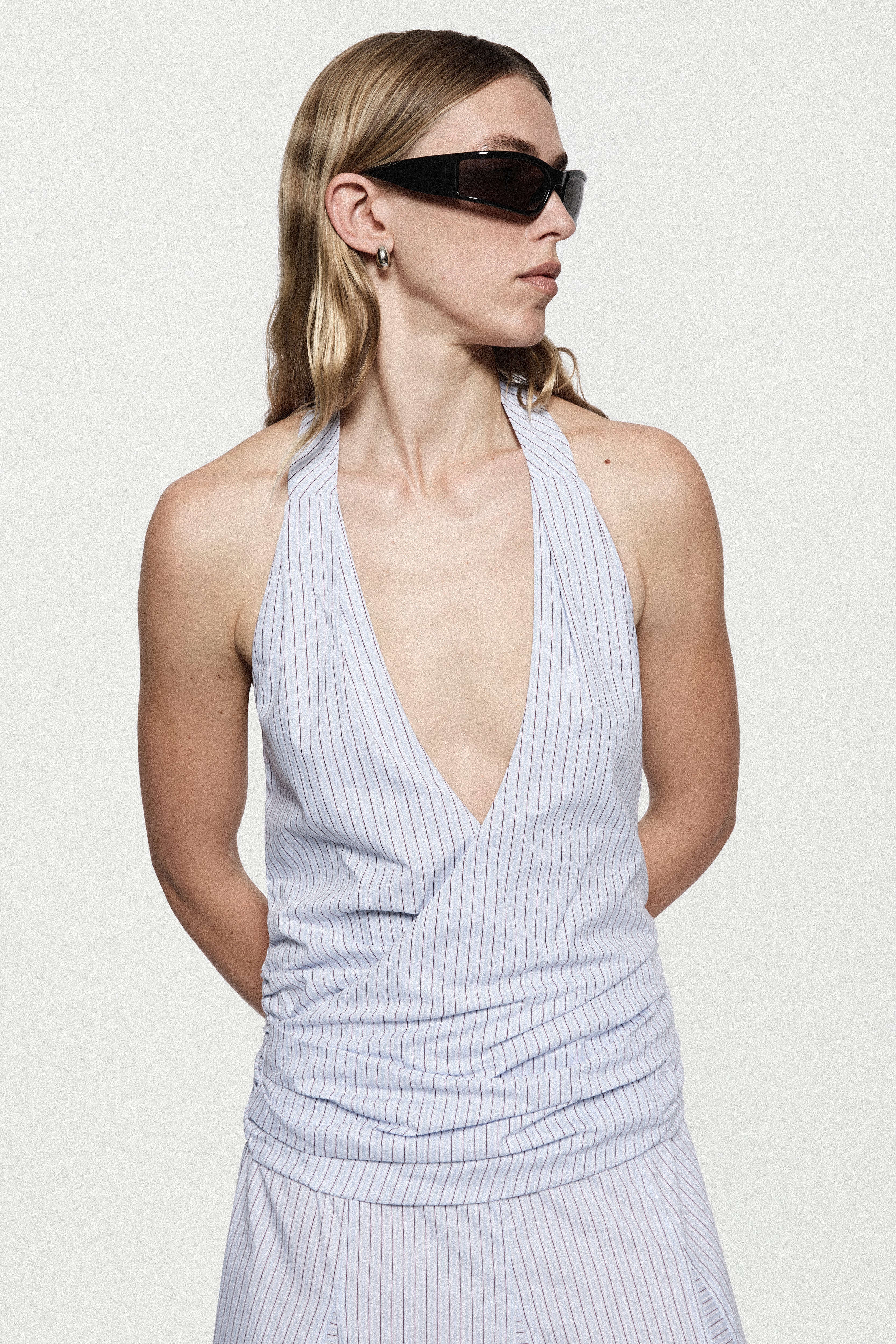 Blue-and-white striped cotton maxi dress close-up with V-neck halter and ruching