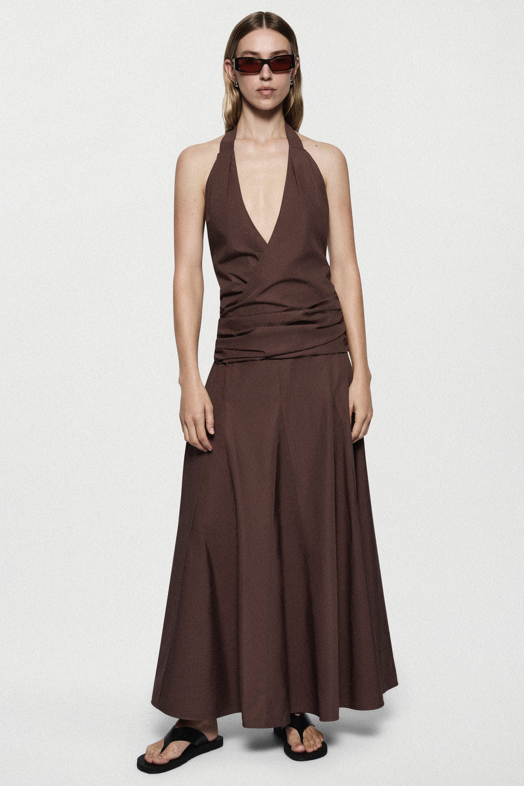 Brown cotton halter maxi dress with deep V front and flowing A-line skirt