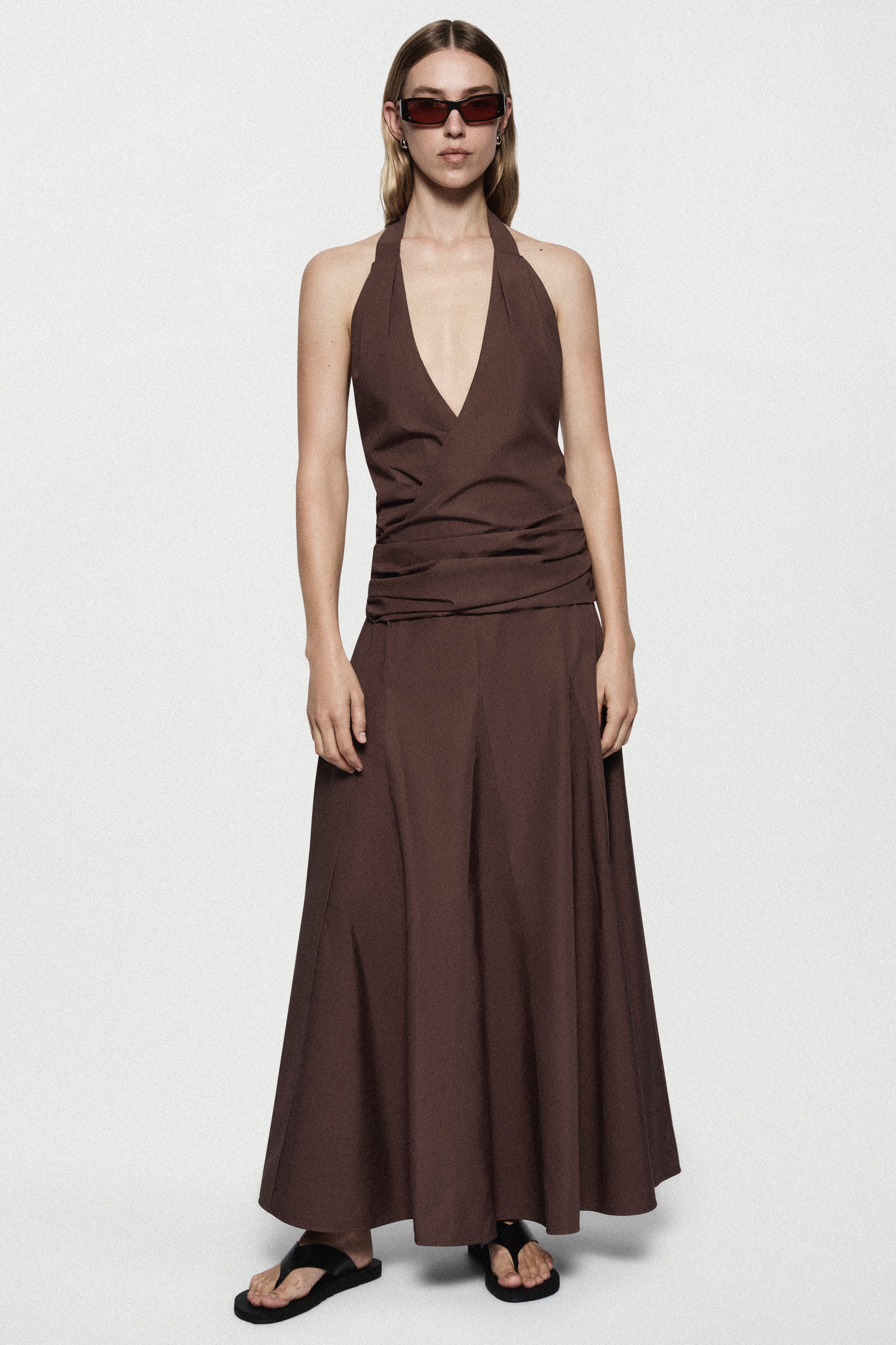 Brown cotton halter maxi dress with deep V front and flowing A-line skirt
