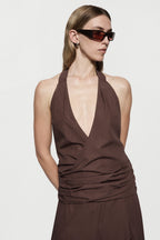 Brown cotton halter maxi dress with deep V neckline and ruched waist