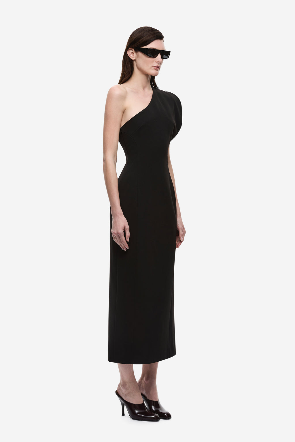 Black one-shoulder midi dress with diagonal neckline and sleeveless fit