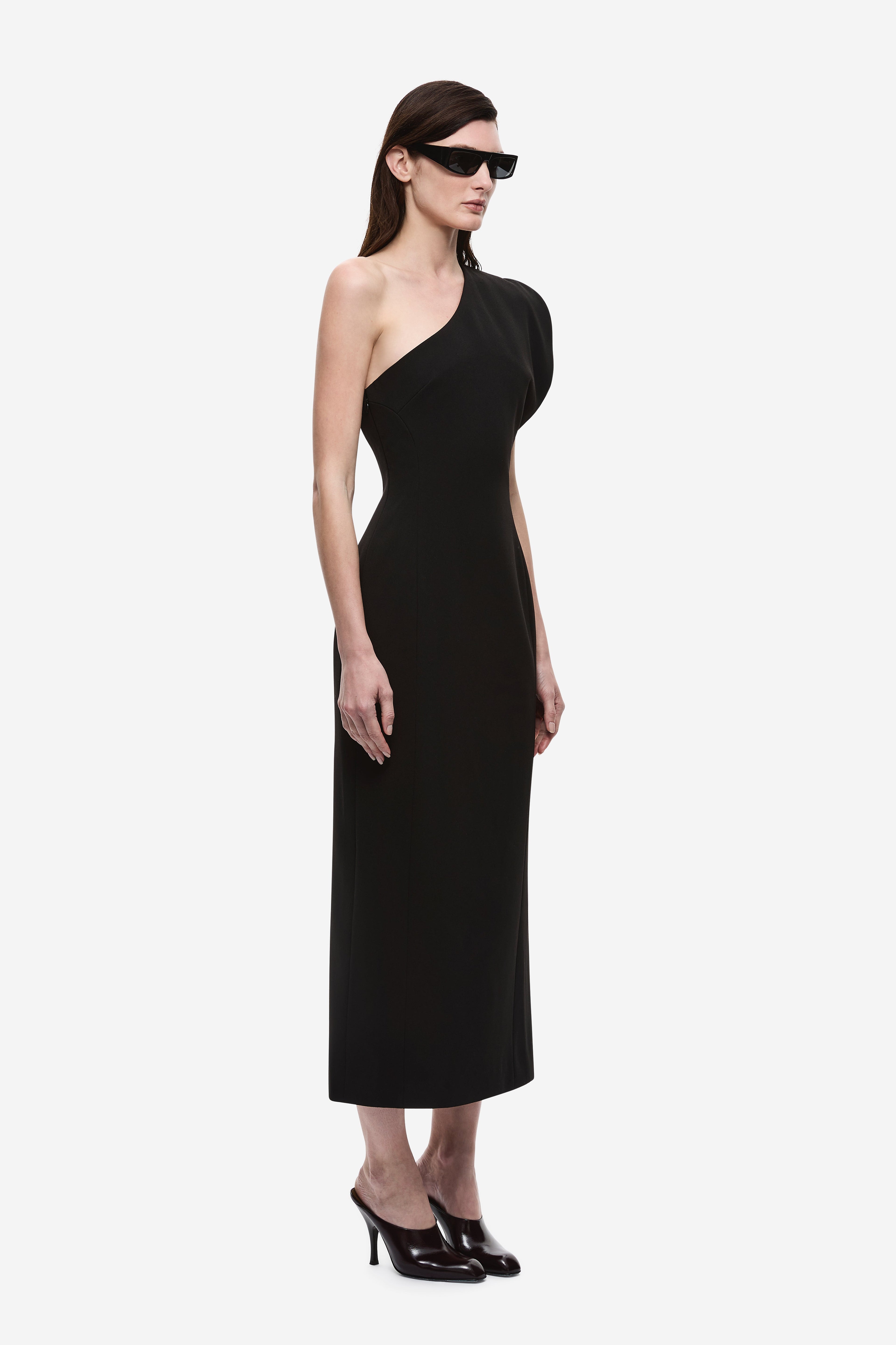 Black one-shoulder midi dress with diagonal neckline and sleeveless fit