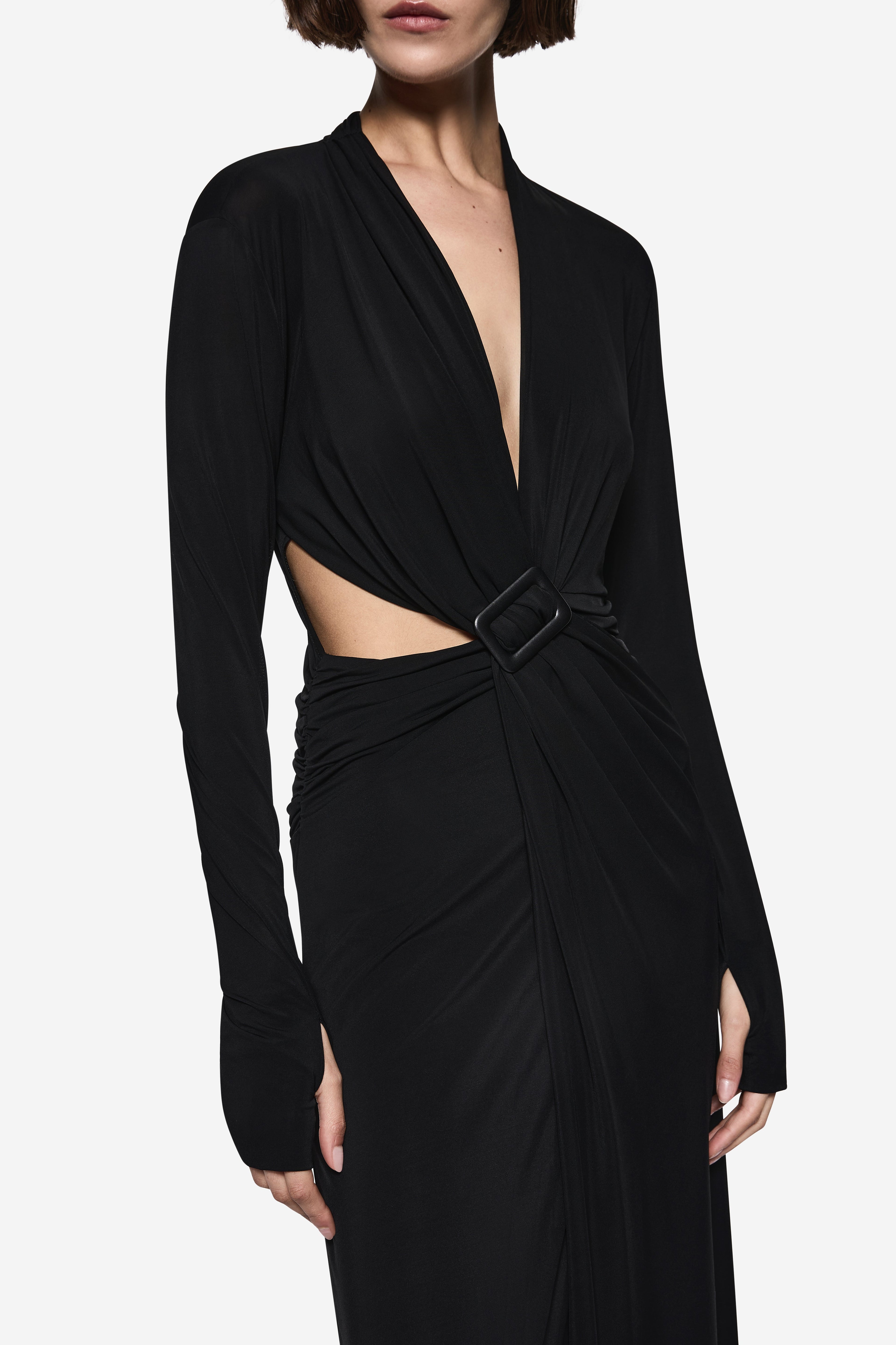 Black wrap maxi dress detail: V-neck, layered drape and waist belt