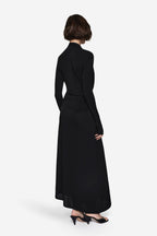 Black long-sleeve wrap maxi dress, back view with draped waist belt