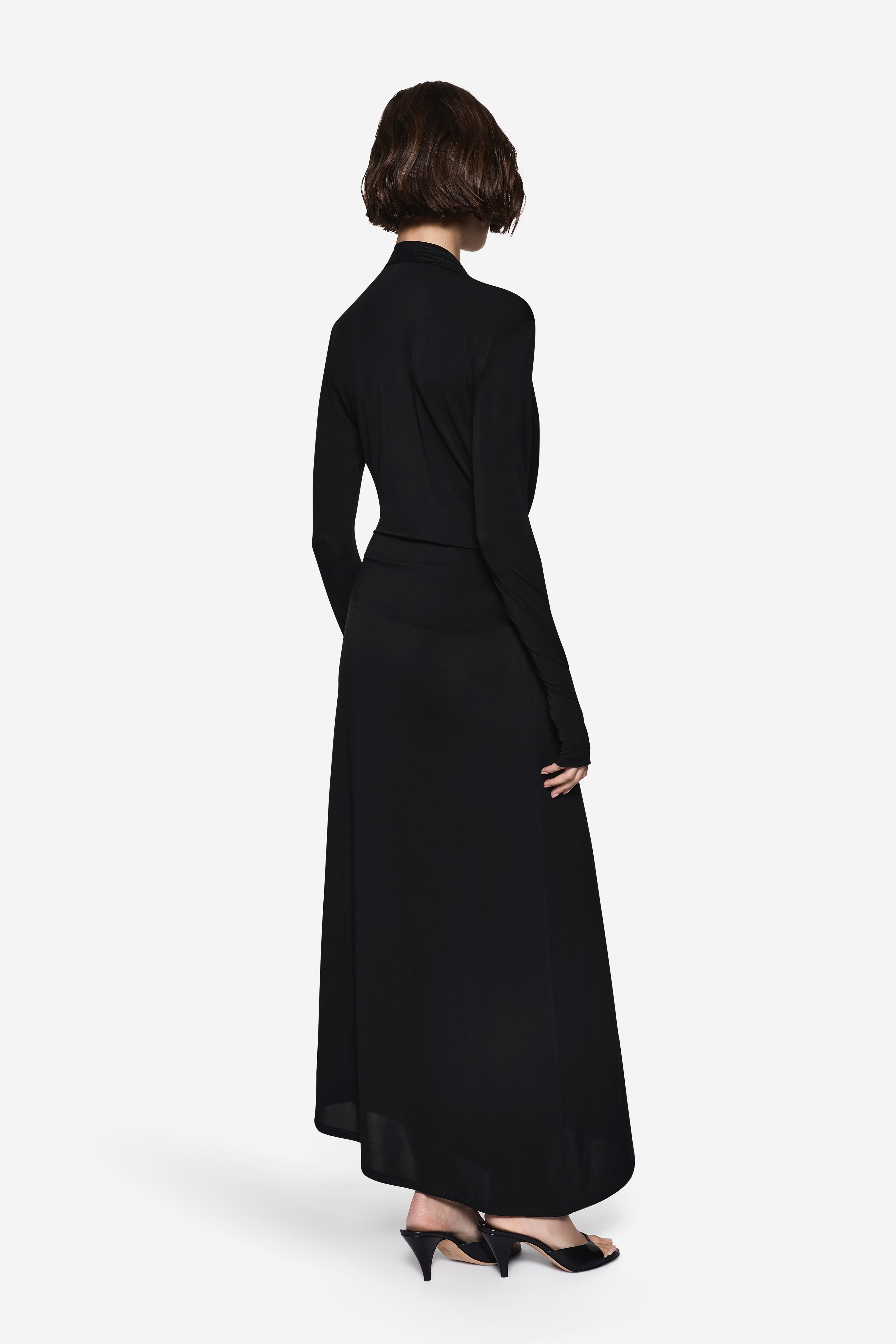 Black long-sleeve wrap maxi dress, back view with draped waist belt
