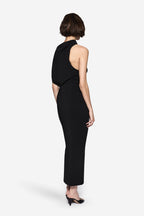 Back view of black structured halter midi dress with open back and asymmetric drape
