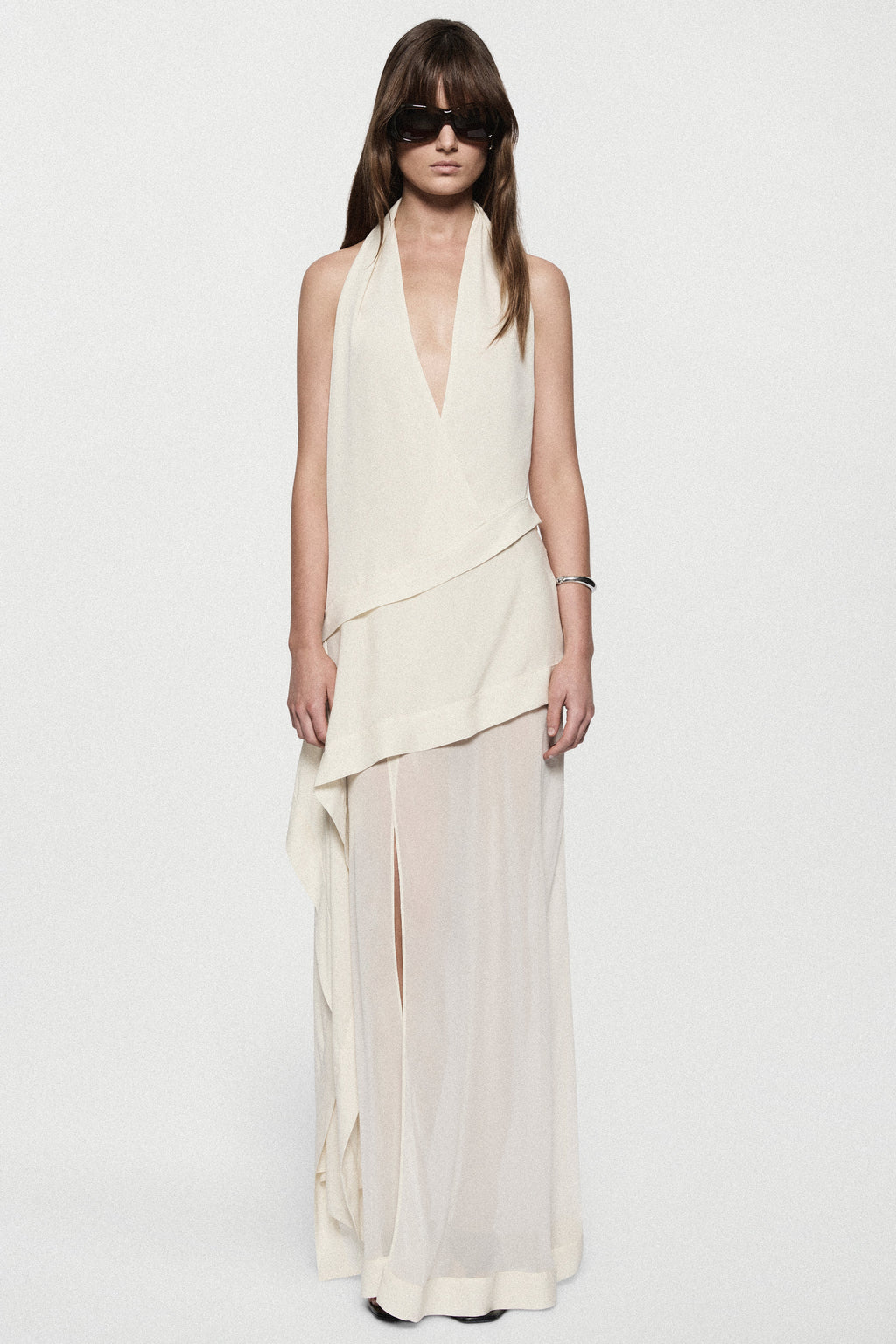 Off-white silk halter maxi dress with draped V-neck and high-low asymmetric hem