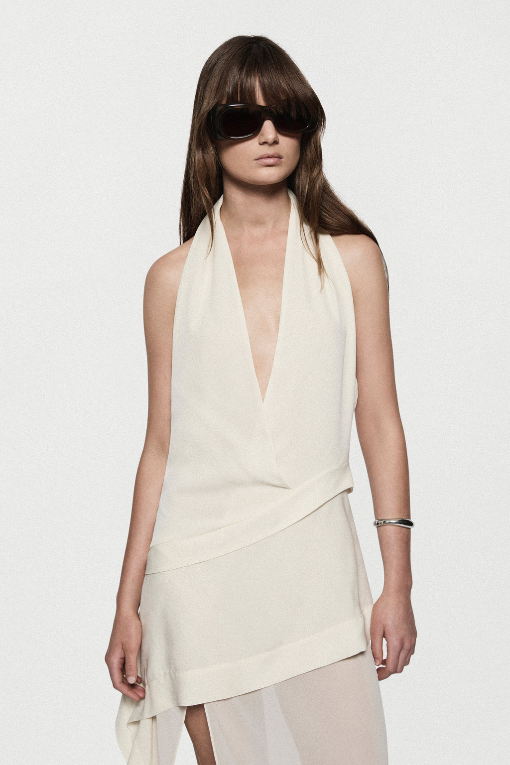Off-white silk halter maxi dress with plunging V halter and layered front panels