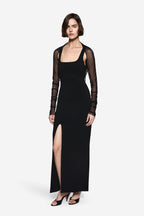 Black compact knit maxi dress with square neckline and side slit, sheer sleeve overlay