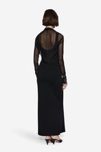 Black compact knit maxi dress with sheer long-sleeve back panel and floor-length hem