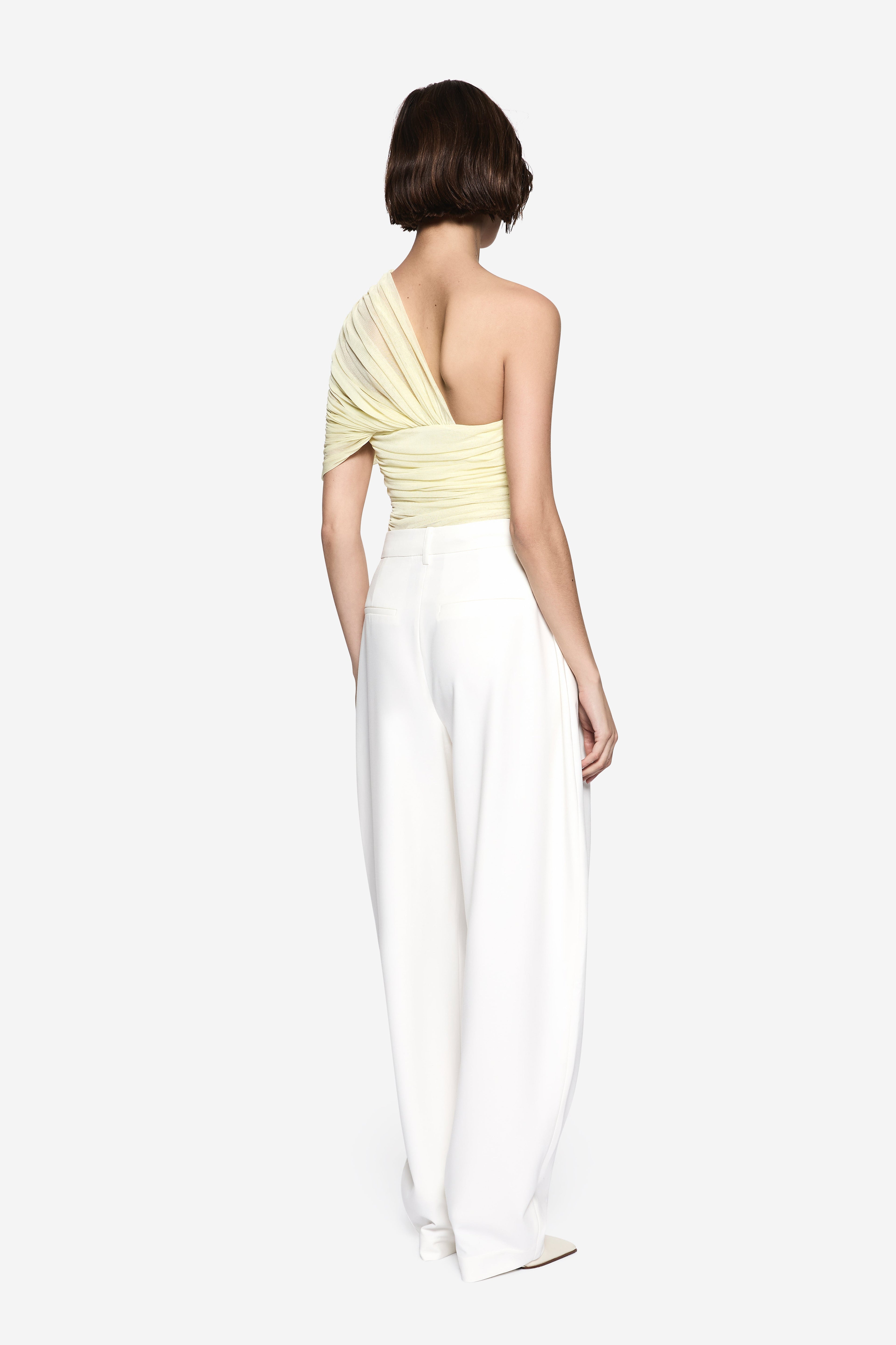 Lemon silk one-shoulder top, back view with ruched draping