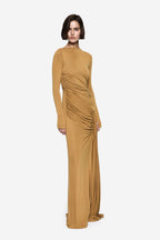 Mustard gold long-sleeve maxi dress with diagonal ruched drape at waist
