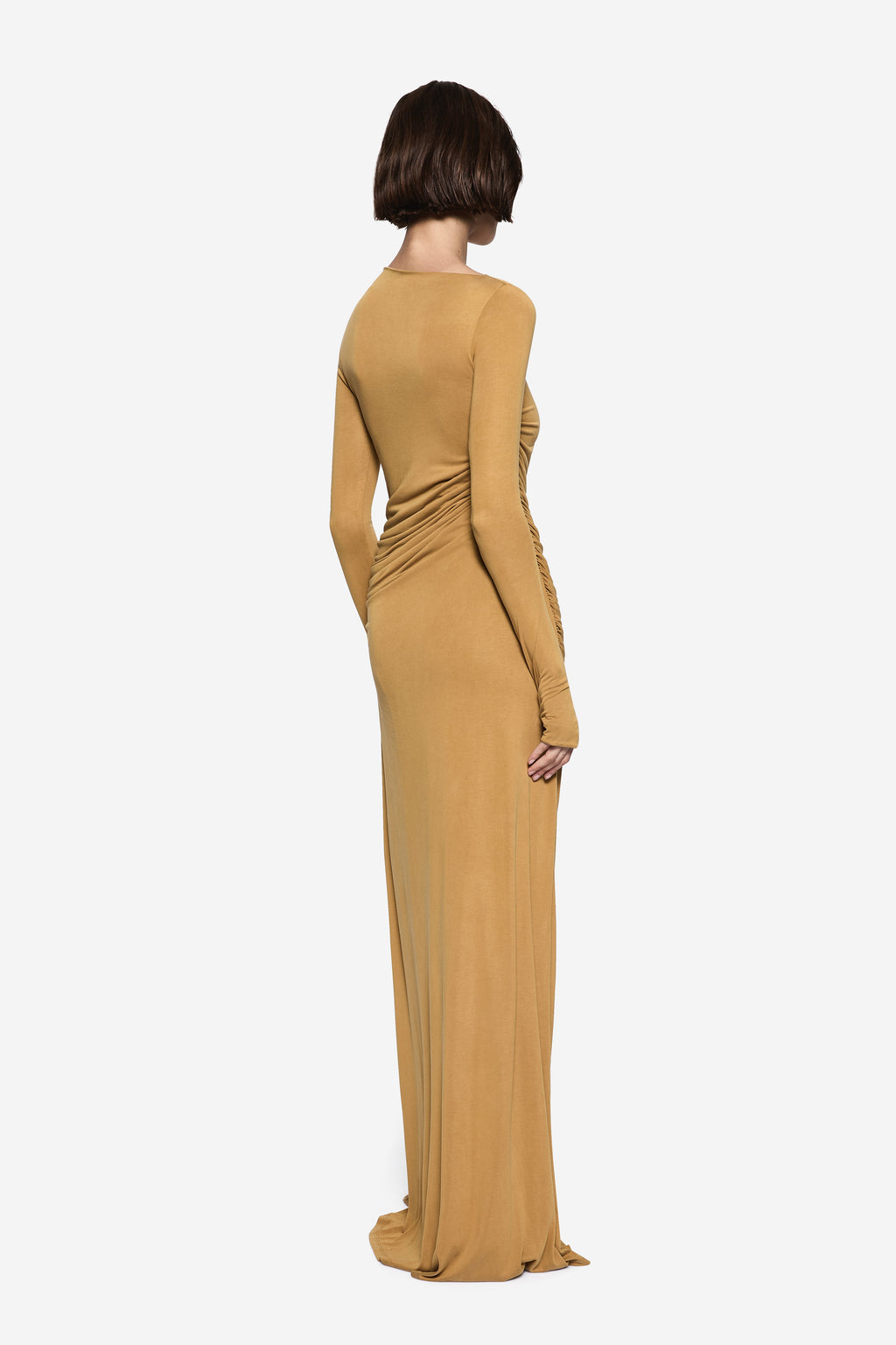 Mustard gold long-sleeve maxi dress with ruched wrap-style back and draped side
