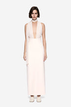 Soft pink silk halter dress with high neckline, deep front cutout, sleeveless column fit
