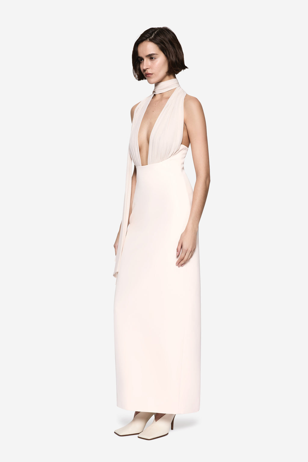 Soft pink silk halter midi dress with open back detail and draped side panels