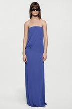 Deep blue strapless jersey maxi dress with draped bodice and side gathers.