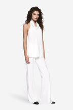 Ivory silk bias pants with draped wide legs and waistband, full-length view