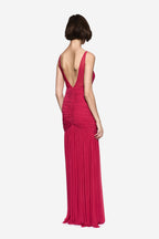 Hot pink jersey maxi dress, open back with crossed straps, ruched bodice and pleated skirt