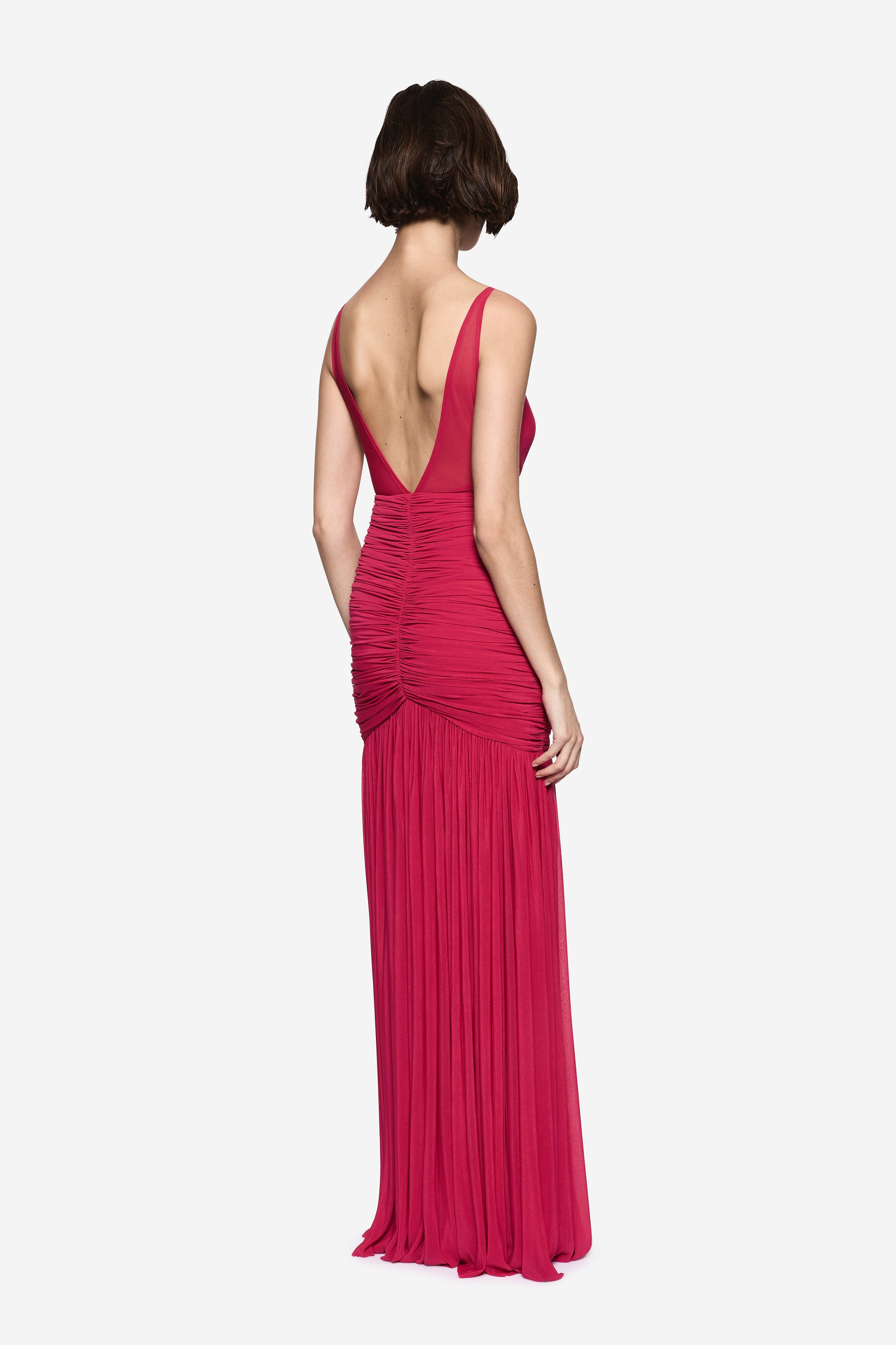 Hot pink jersey maxi dress, open back with crossed straps, ruched bodice and pleated skirt