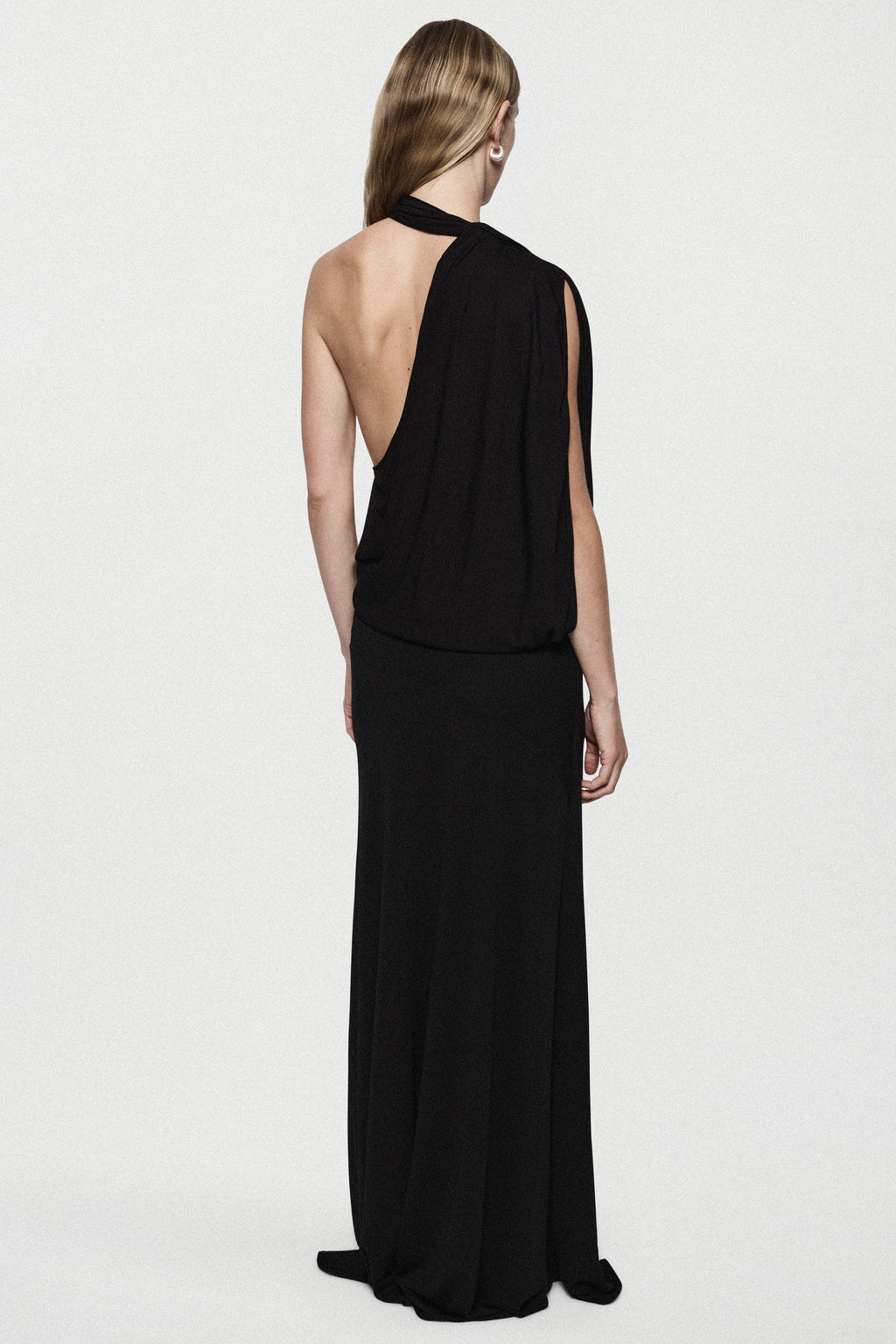 Black sleeveless cowl gown, open back design, draped neckline and long column skirt