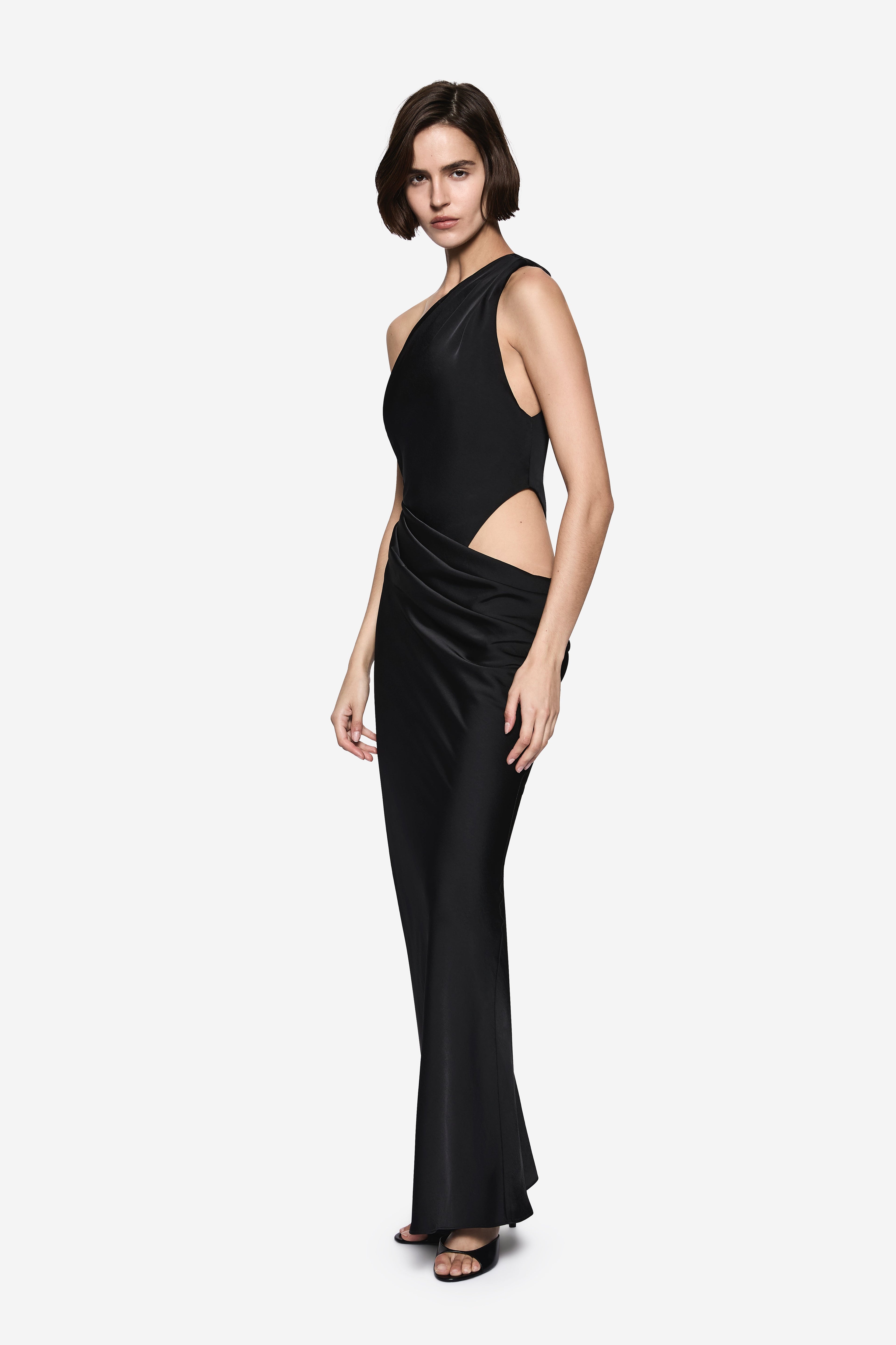 Black satin maxi dress with halter neckline and waist cutout