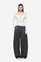 Ivory off-shoulder long-sleeve keyhole top with gathered neckline and seam details