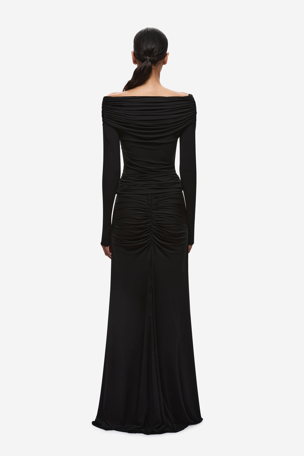 Black off-shoulder ruched back view with draped long-sleeve bodice