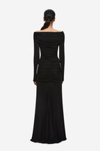 Black off-shoulder ruched back view with draped long-sleeve bodice