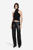 Black compact knit halter top with draped wrap front and high neckline