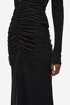 Black ruched long-sleeve top with gathered pleats at the side