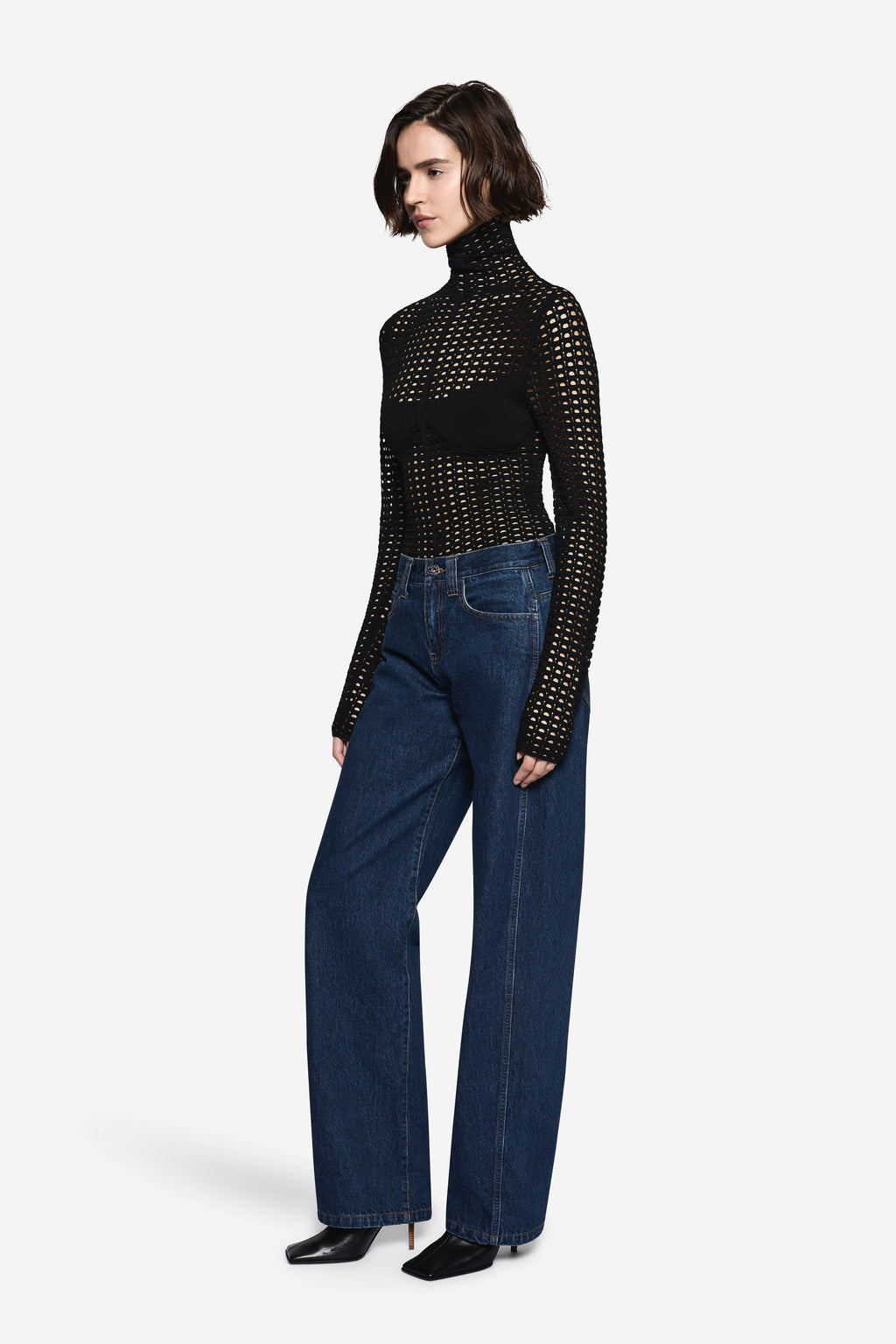 Black open-knit long sleeve turtleneck top with dotted grid texture