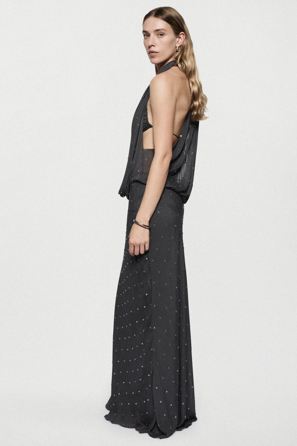 Dark charcoal rhinestone cowl gown, sleeveless with draped side wrap, floor length