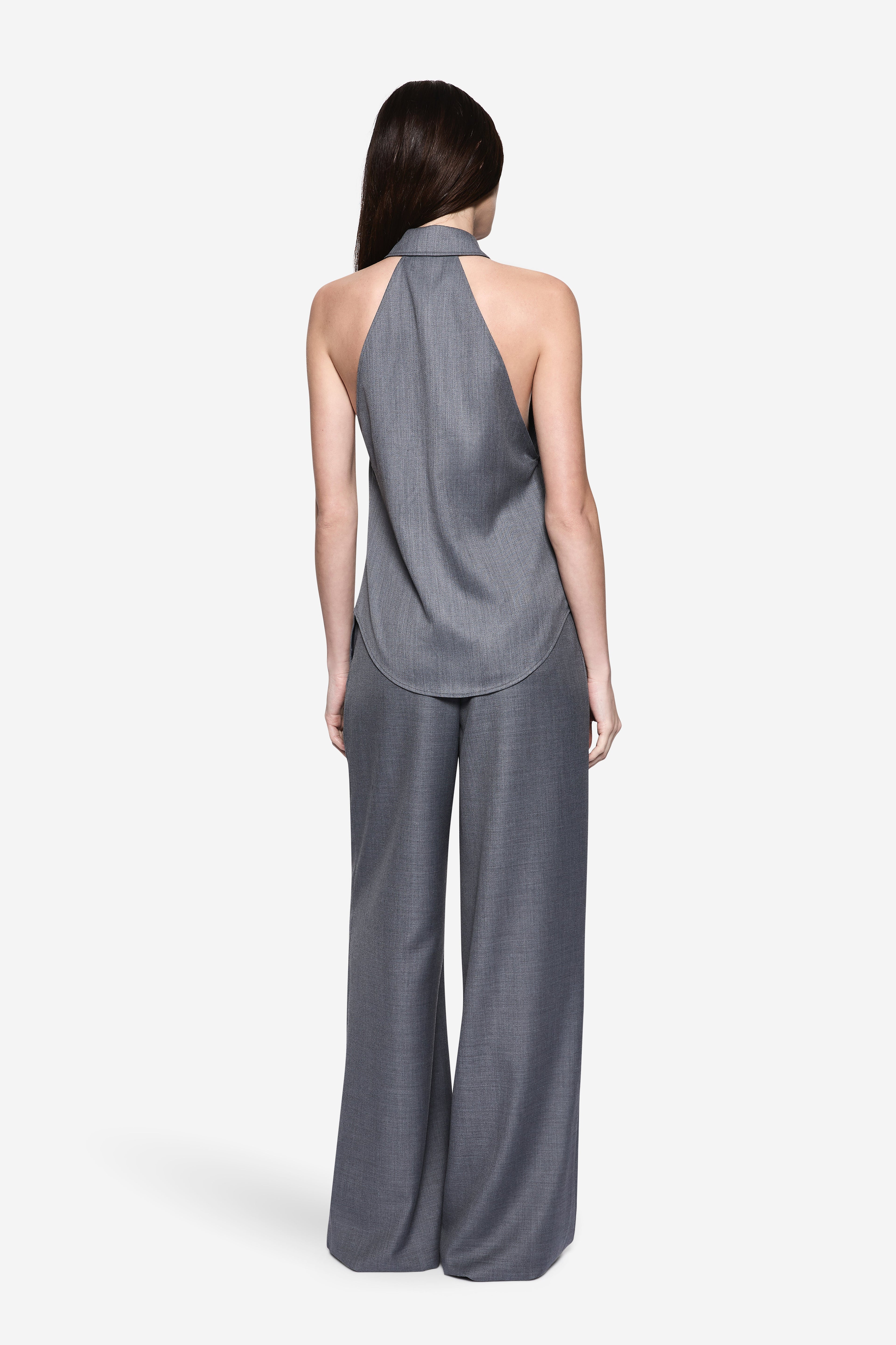 Back view of grey halter suiting shirt with open back and pointed collar
