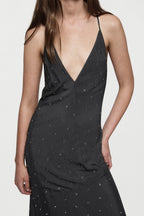 Rhinestone slip gown with V-neck spaghetti straps and scattered sparkle dots