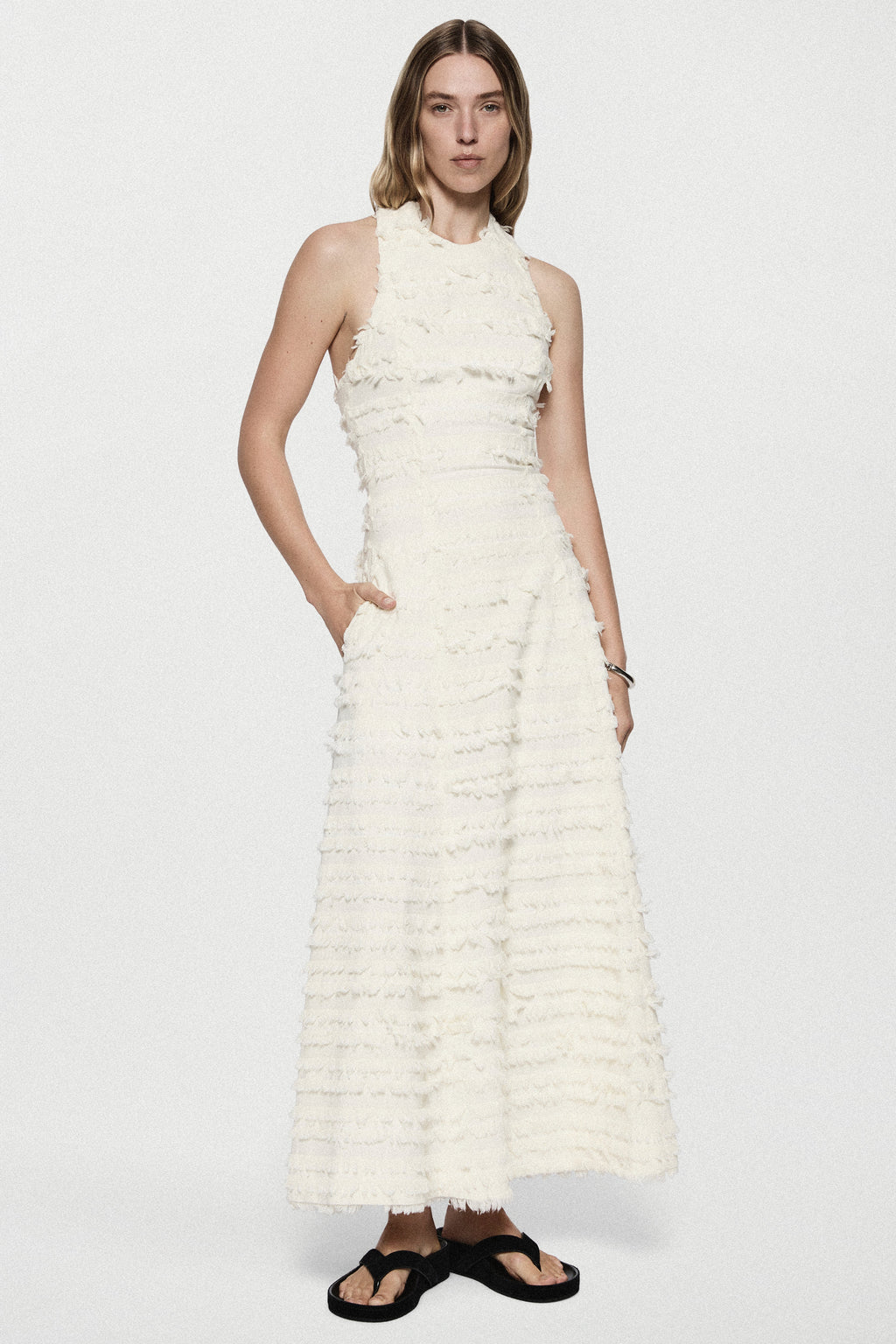 Winter white cotton fringe dress, sleeveless tiered ruffles, front view